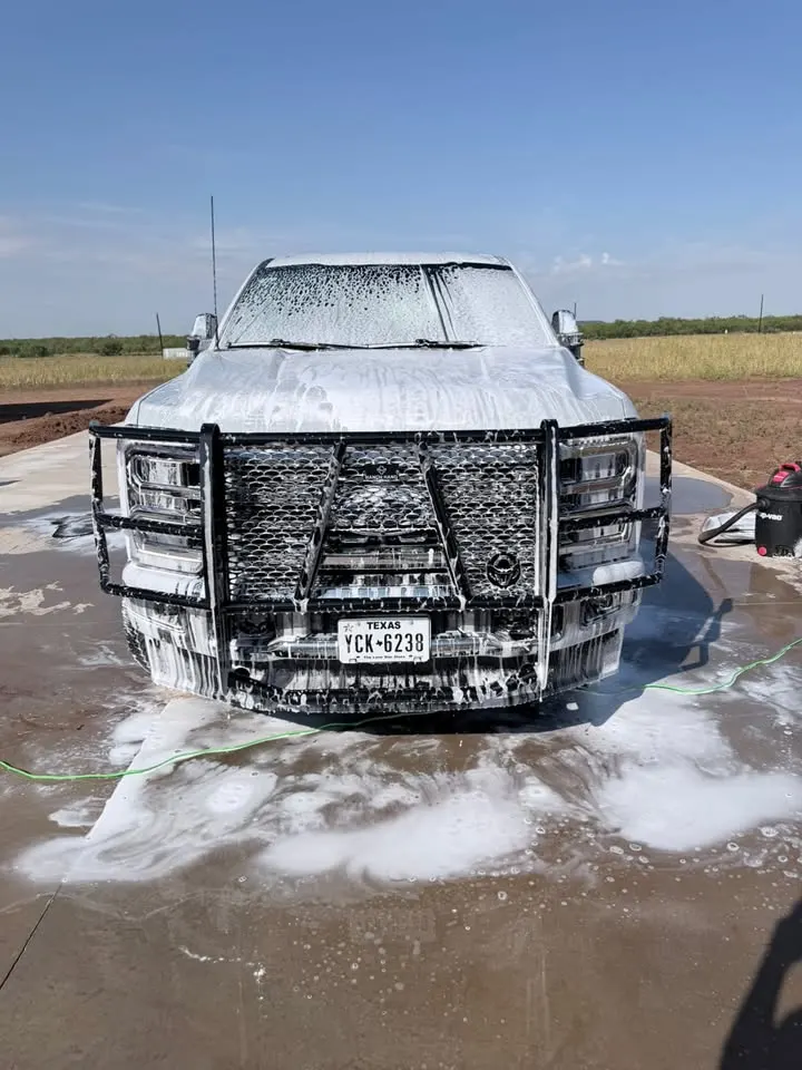 Truck covered in foam prewash